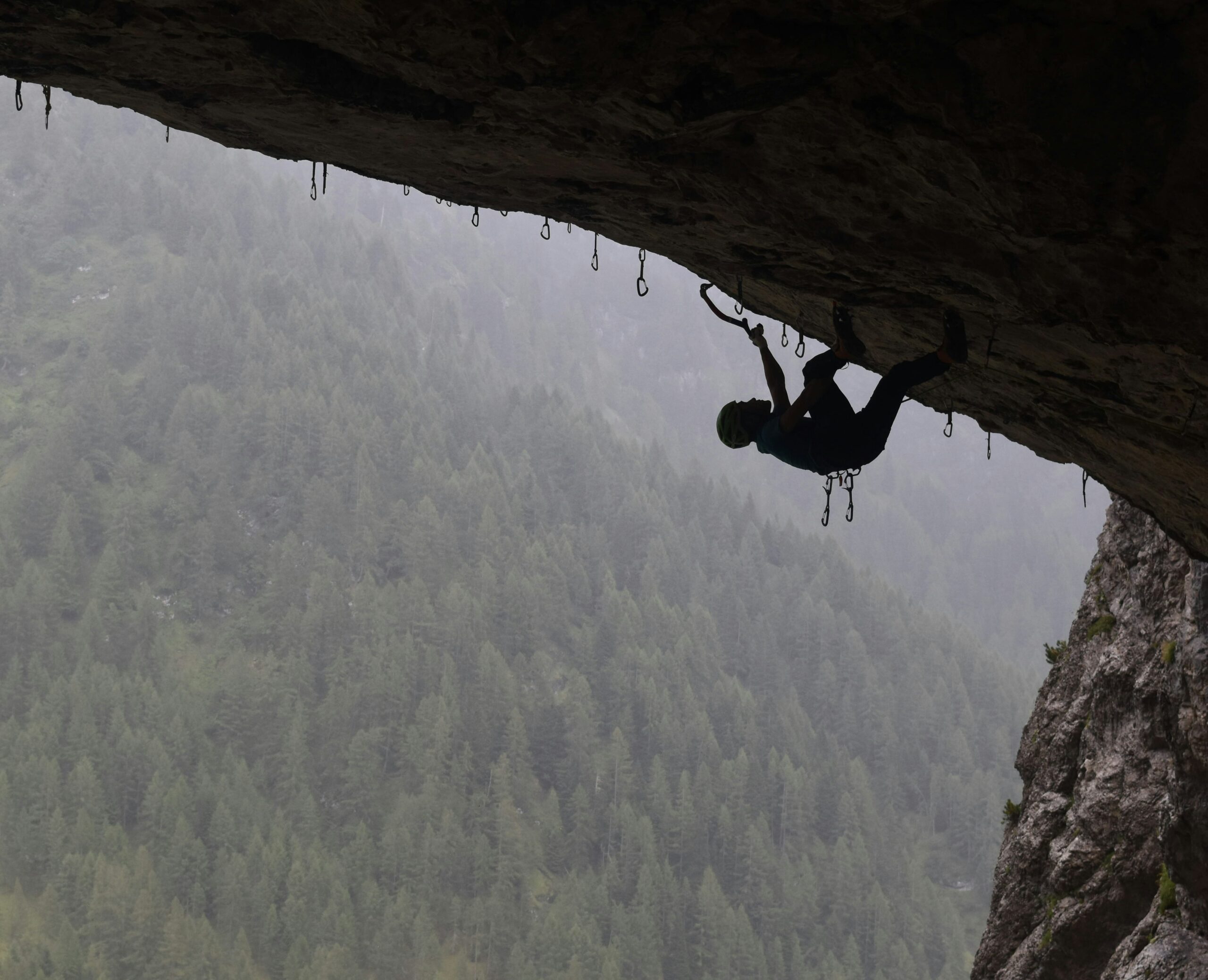 An indoor climber scaling a wall