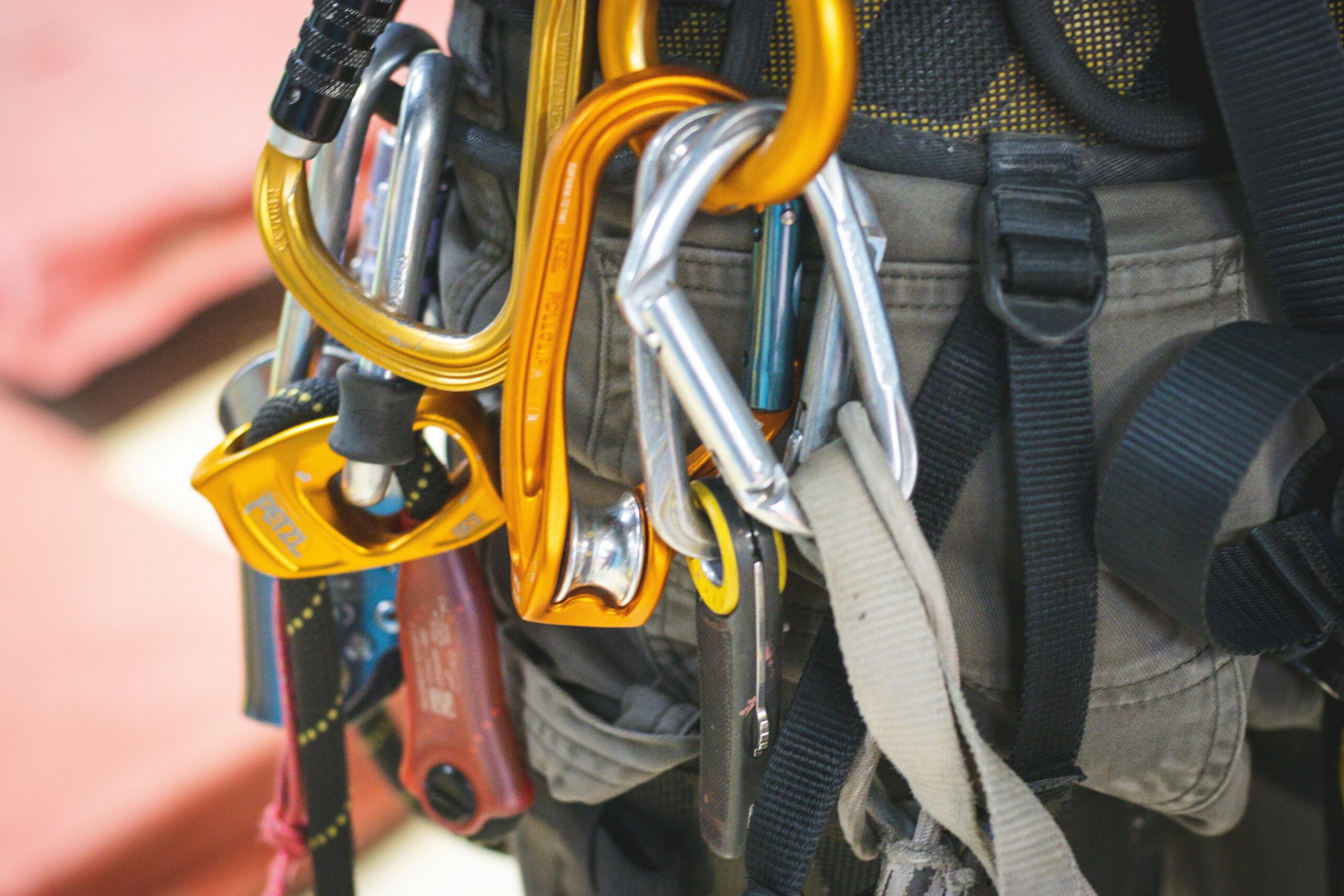 Illustration showing proper use of climbing harness vs incorrect usage