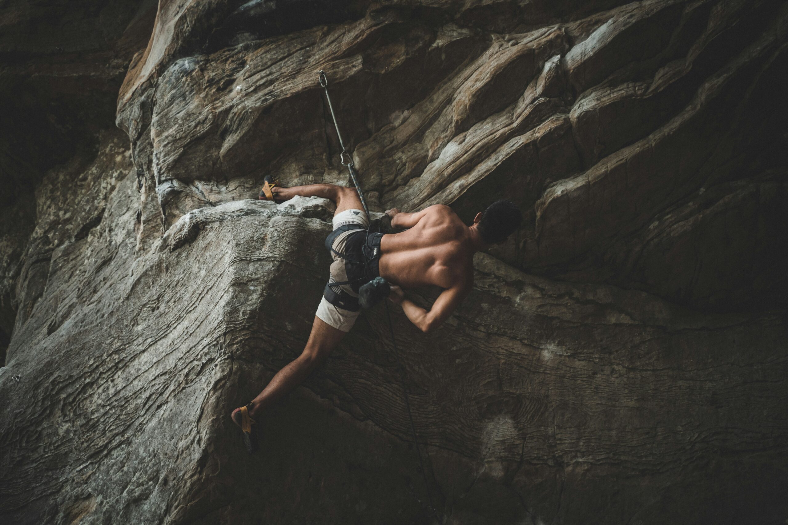 Climber falling due to improperly secured harness