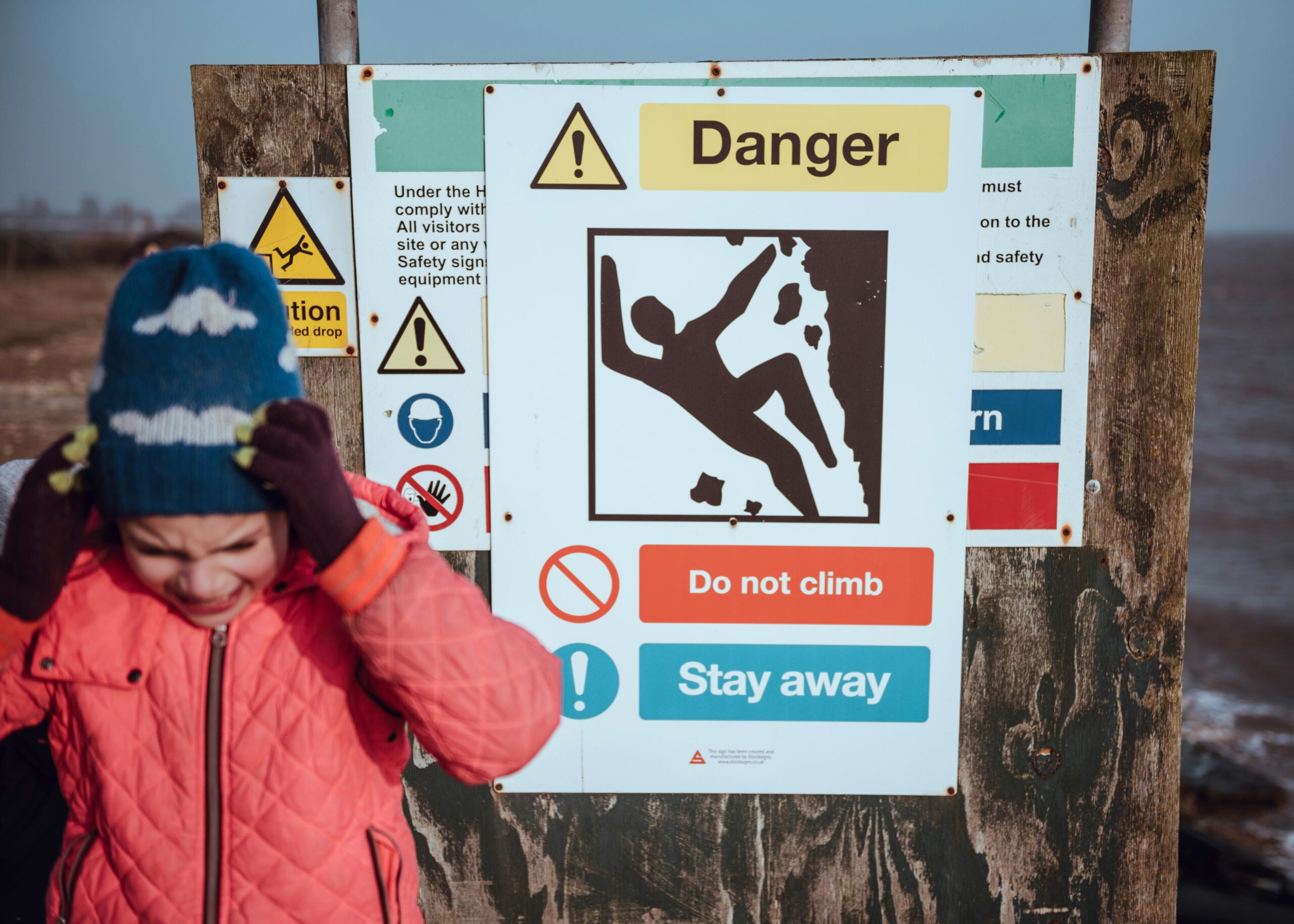 A climber attaching their harness while preparing for a climb.