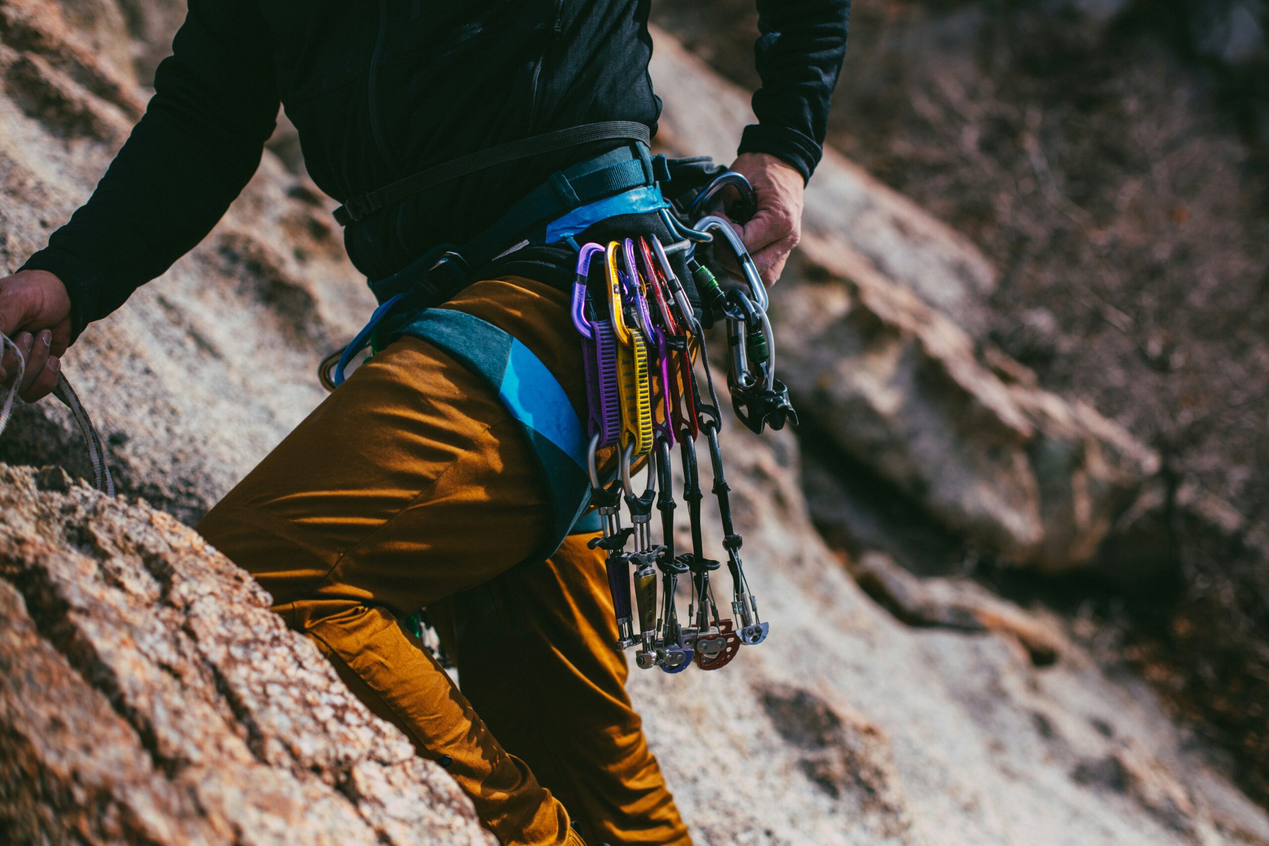 Image of a poorly made climbing harness showing frayed straps