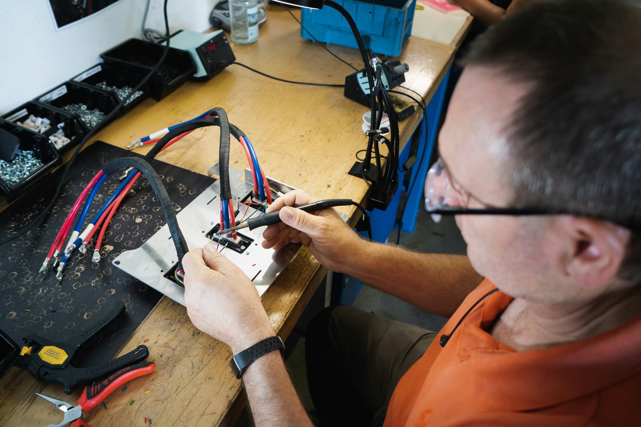 A climber wearing a secure climb harness performing an intense ascent outdoors