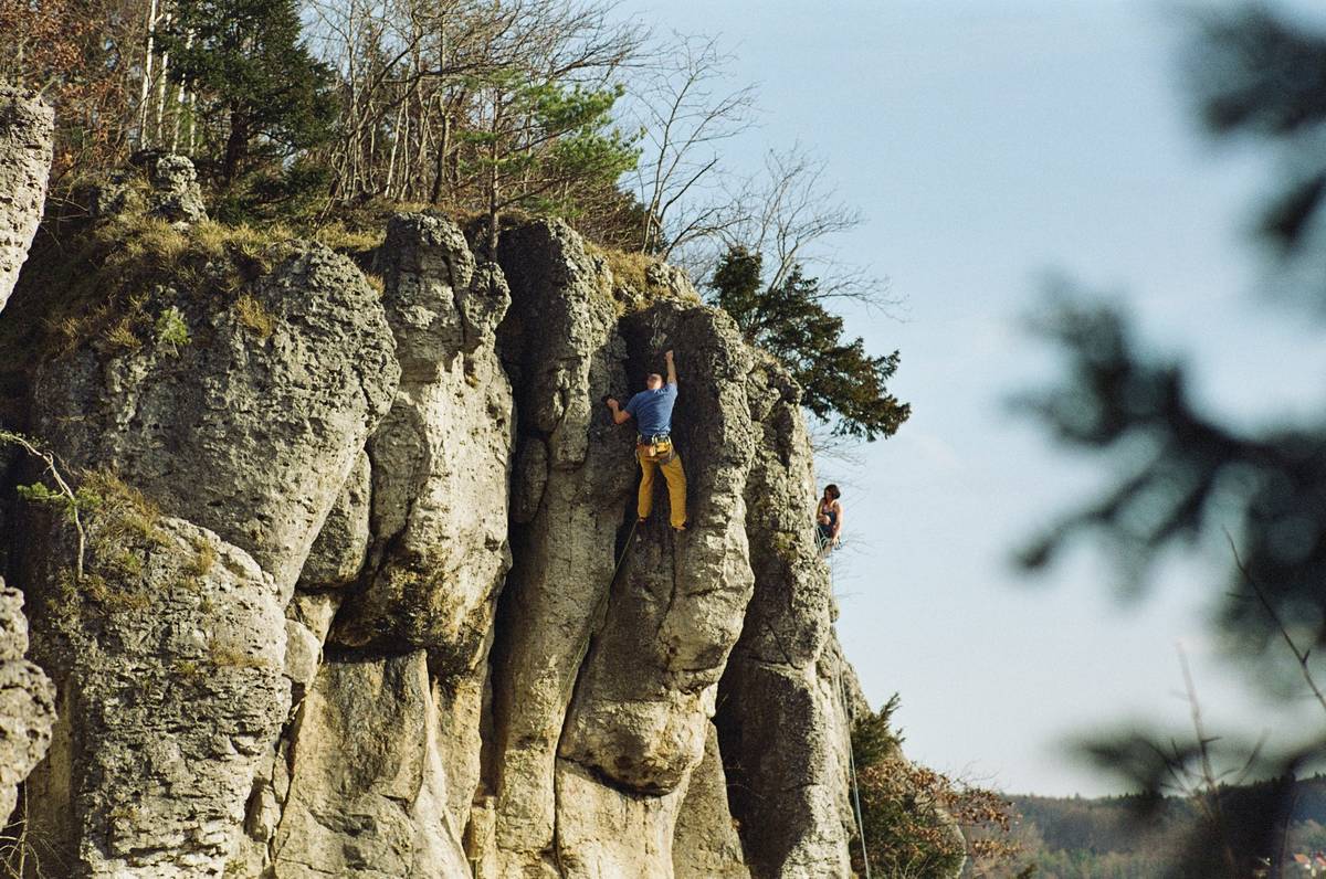 Close-up image showing discomfort caused by poorly adjusted climbing harness