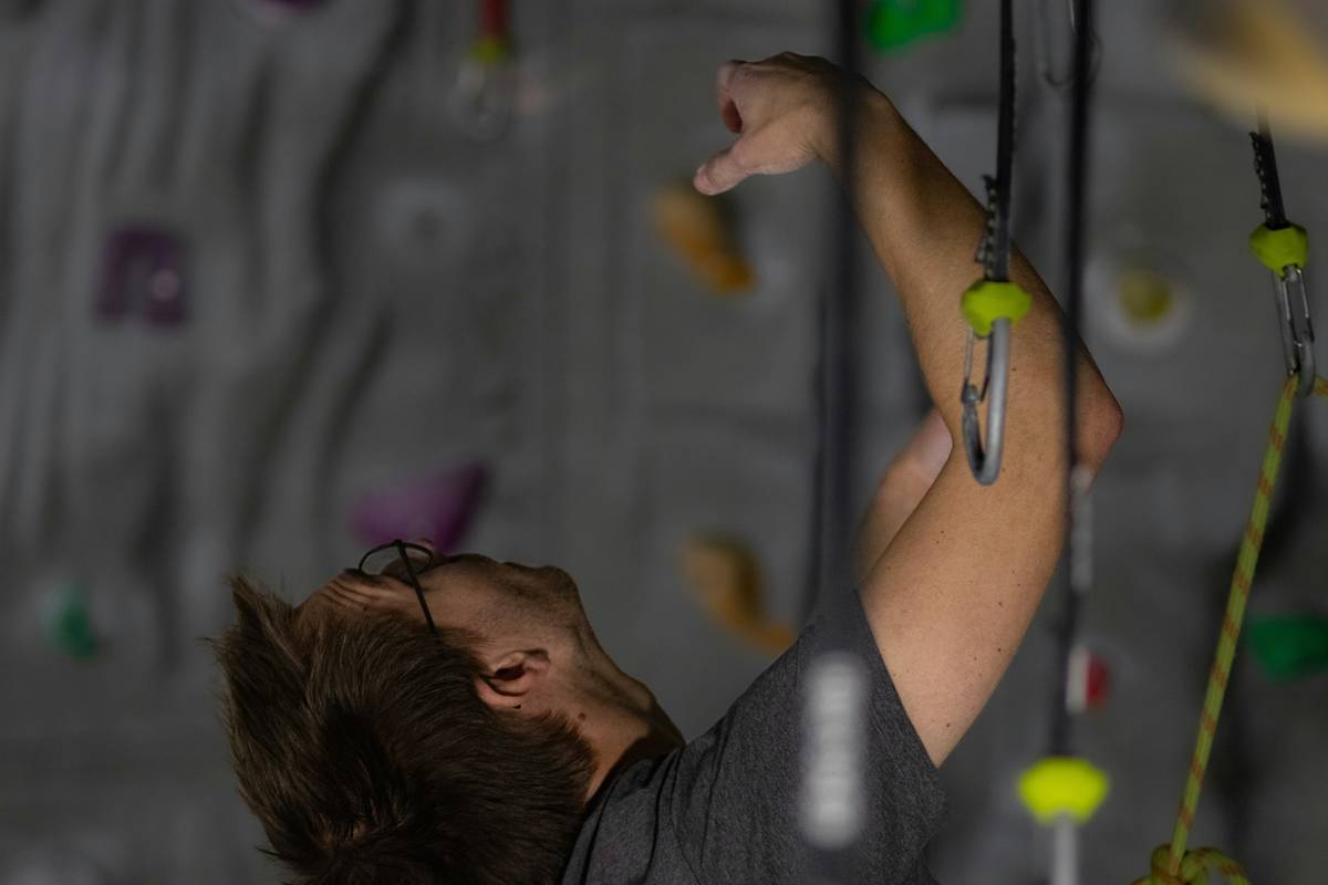 An infographic showing parts of a climbing harness and their functions