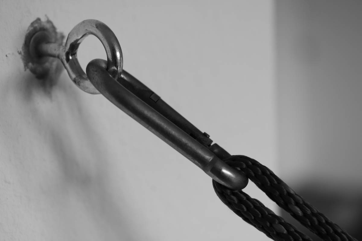 An instructional diagram showing how to adjust a climbing harness properly