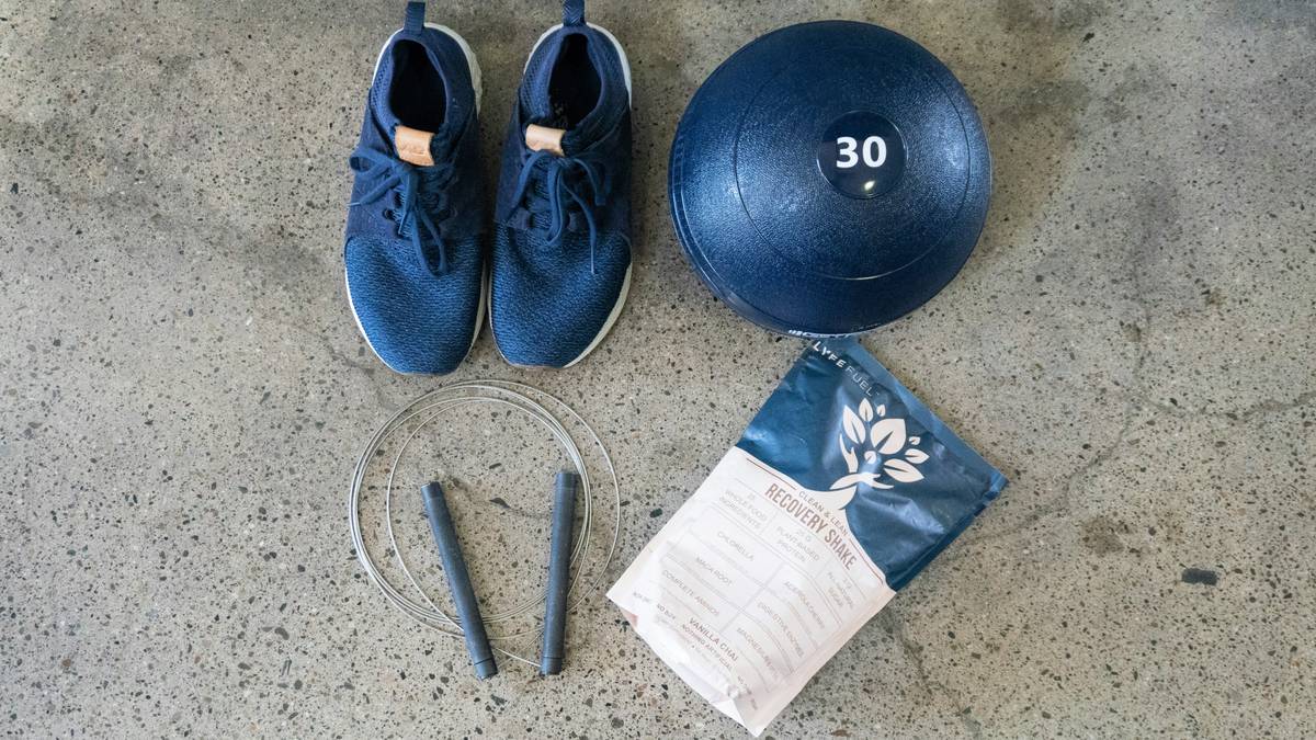 A person using a resistance band as a rope substitute during a workout